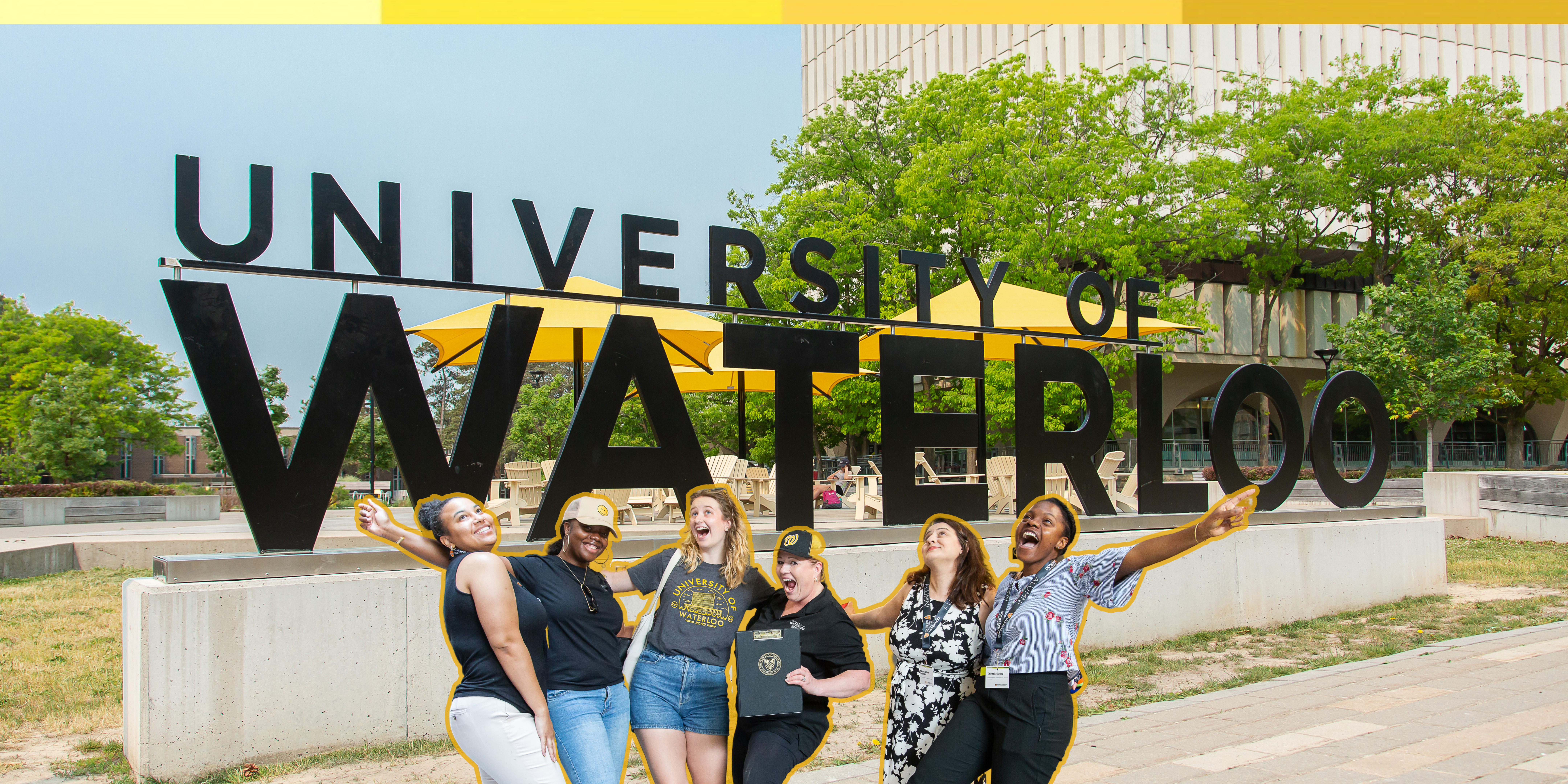 a group of ladies in front of university of waterloo sign