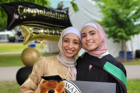 two students celebrating convocation