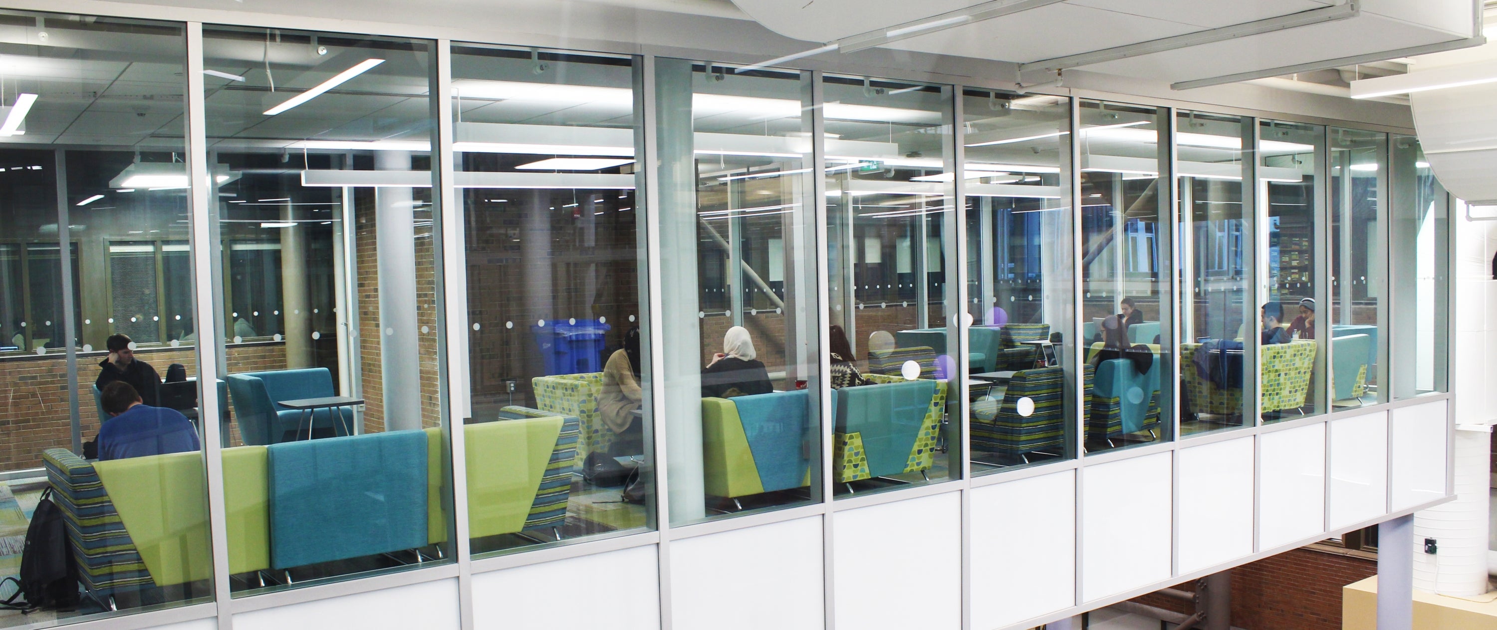 third floor study deck of the hub, with students seated