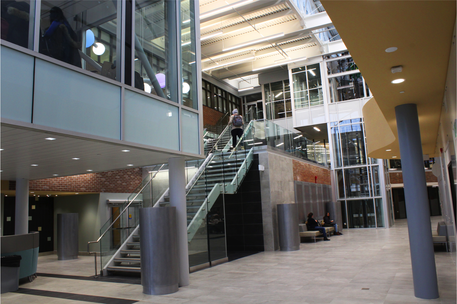 entrance to atrium area with stairs to upper level