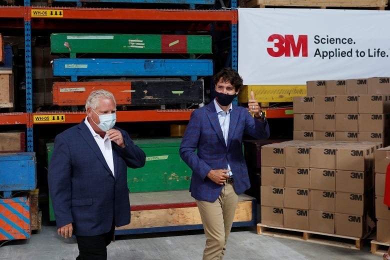 Ontario Premier Doug Ford, left, and Prime Minister Justin Trudeau at the 3M plant in Brockville, Ont., in August, after announcing the facility will be making N95 masks.