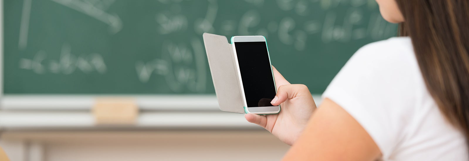 Student holding an iPhone