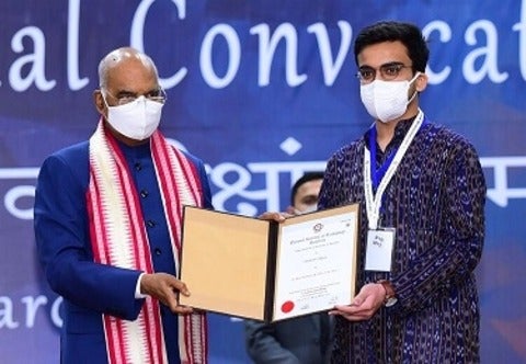 Rishabh Bajaj receiving award
