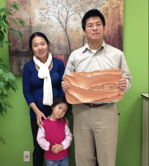 Chen Chi and her family with the Picture Sandstone
