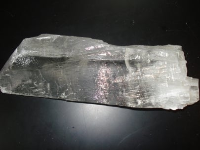 piece of translucent gypsum on black background