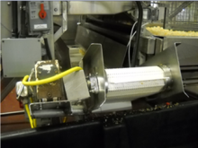 Potato chip conveyer system with waste bin 