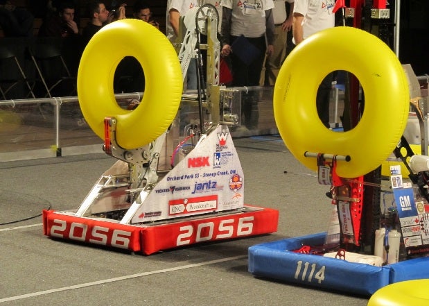 Two robots compete in the FIRST Robotics Waterloo Regional 