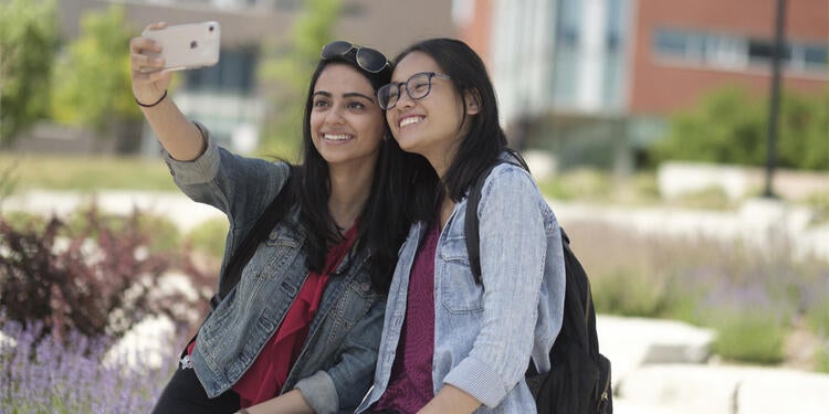 Two Waterloo students taking a photo.
