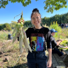 Photo of Christy Argueta braiding corn