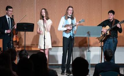 students performing song at Grebel talent show