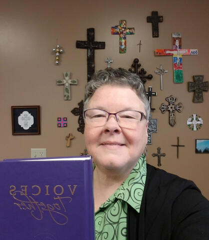 Louise Wideman holding a Hymnal