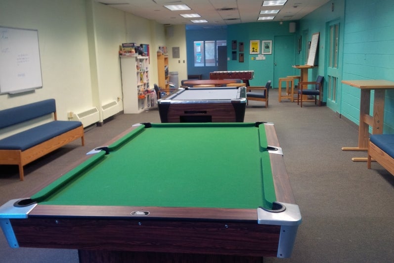 Air hockey, pool table, and couches in the Grebel games lounge