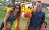 Shawna (Klassen) and Chad Hiley and their daughters with Tigger from Winnie the Pooh.