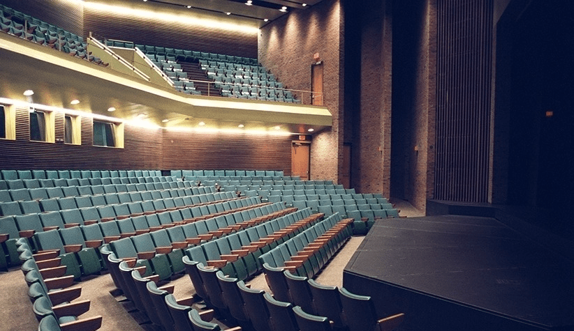 Empty Humanities Theatre seats.