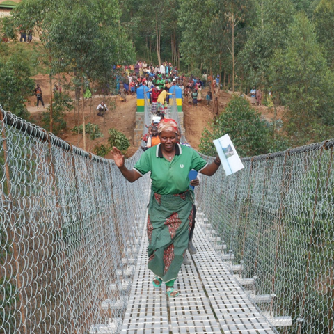 Woman crossing a bridge