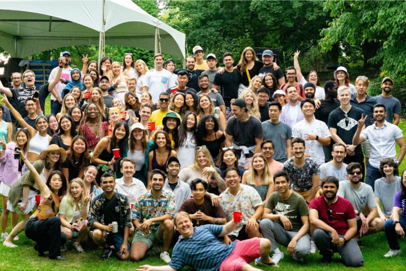 Large group shot of Perpetua employees and co-op students outside at a summer event