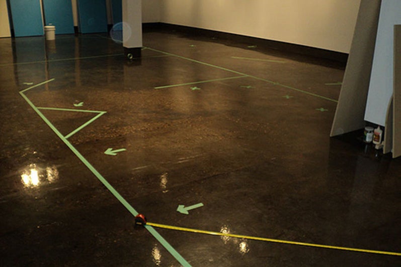 Tape lines outlining the floor plan.