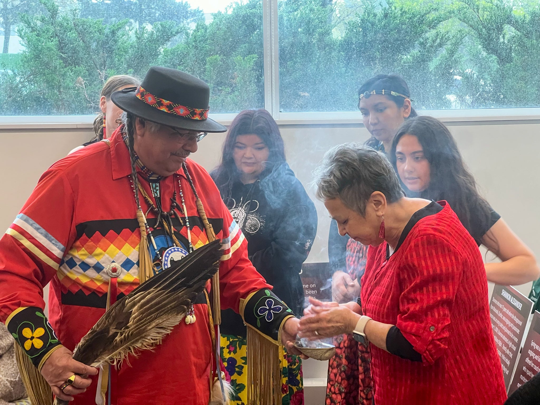Elder Myeengun Henry, Jean Becker and other members of the Indigenous community gather for smudging on Red Dress Day