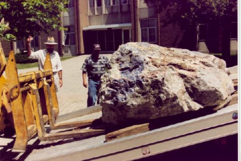 Bulldozer unloading a rock.