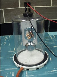 Photograph of bell in a vacuum jar