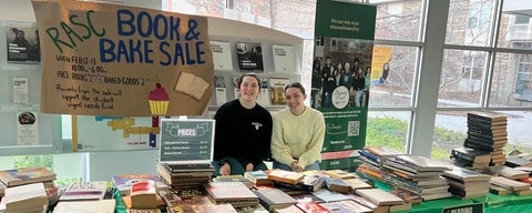 RASC Book and Bake Sale two students with books