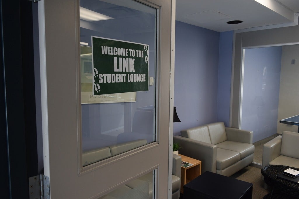 Door to the Link Lounge with a sign on the door. 