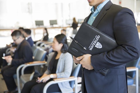 Student holding folder