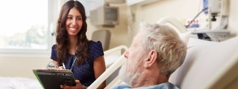 Article banner - interviewer with patient at a hospital