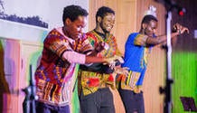 three students perform traditional African dance routine