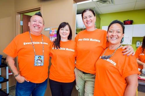 Waterloo Indigenous Student Centre staff wearing orange every child matters shirts
