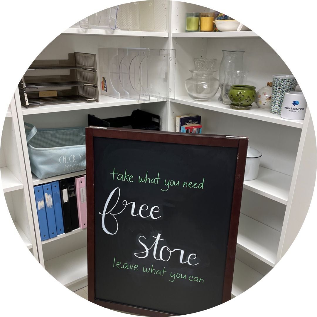 Free Store sign in front of shelving unit with inventory