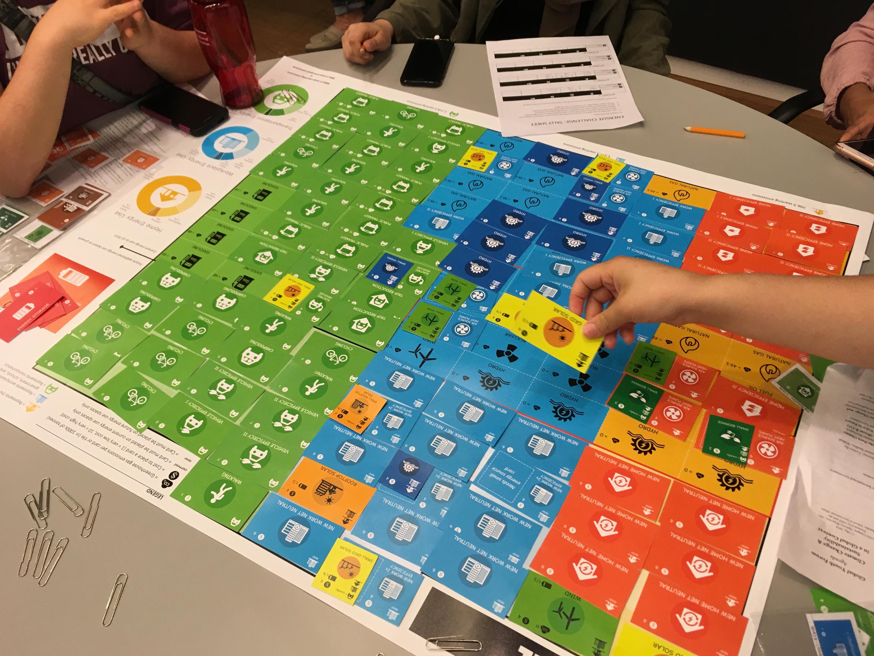Two students playing Energize board game
