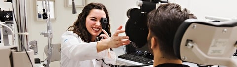 A student performs an eye exam