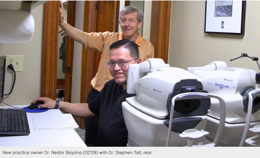 Dr. Steven Tait stands with new clinic owner Dr. Nestor Bayona (OD "09)
