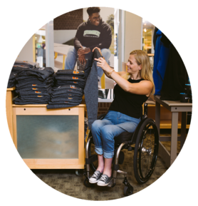 Woman in wheelchair browsing clothes