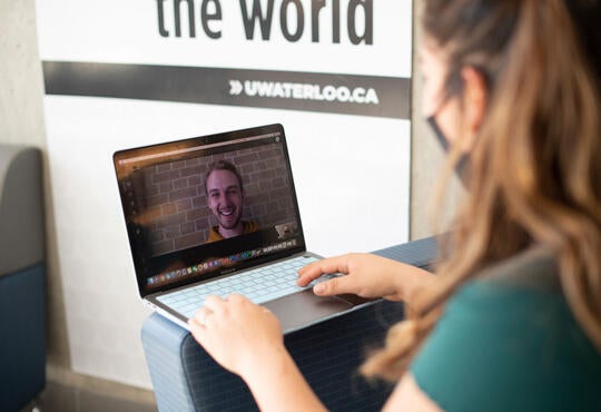 Close up shot of a woman speaking to a man on a video call