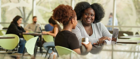 Two University of Waterloo students in a brightly lit space