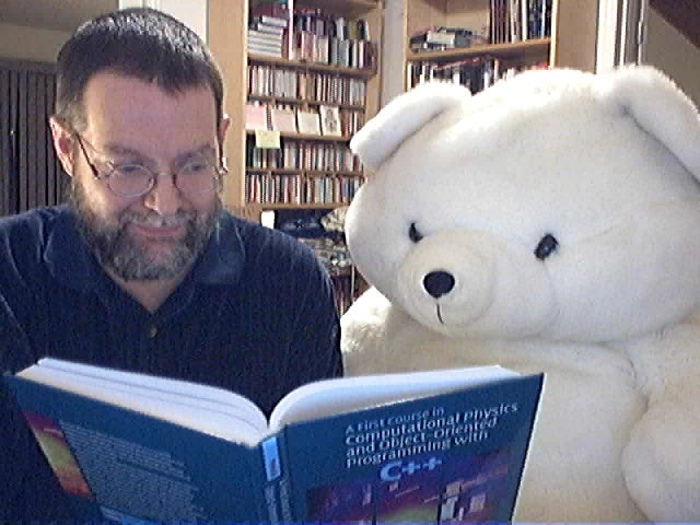David Yevick reading with a teddy bear