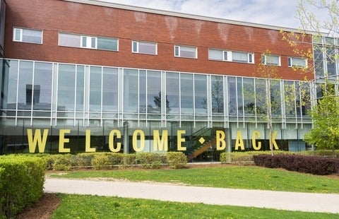 A "welcome back" sign on campus
