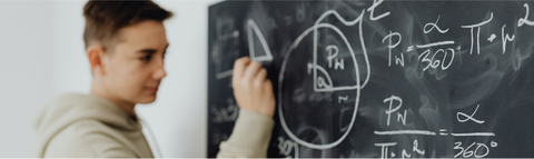Student writing on a whiteboard
