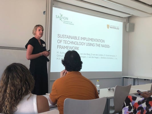 Saxion University researcher presenting at a conference