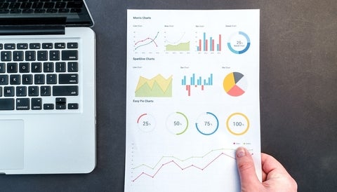 Macbook and a page of charts