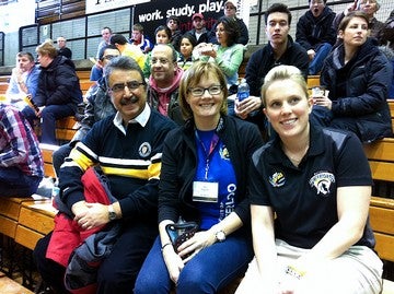 University of Waterloo President and two female staff at game