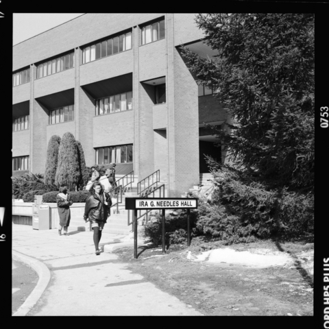 Man walking out of Needles Hall in 1998