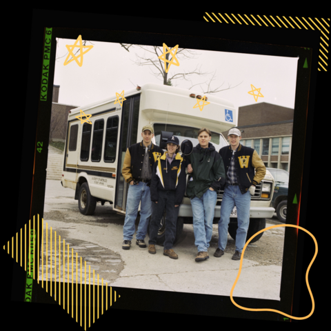 Group of students standing in front of bus on film with yellow graphics in background