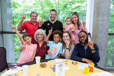 Families sitting at a table together