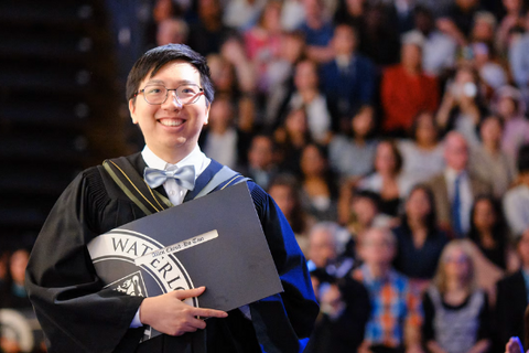 a graduate student smiling