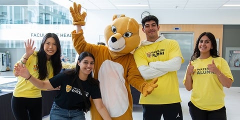 Volunteers smiling and posing