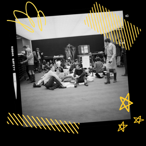 Group of students sitting on the ground captured on film with yellow graphics in background