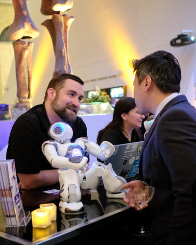 two people speaking at the rom